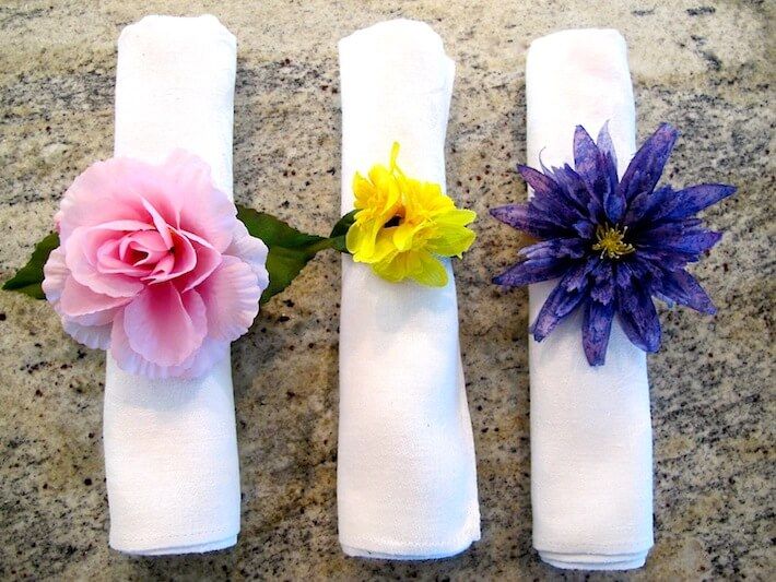 Floral-napkin-rings-or-tied-fabric-napkins