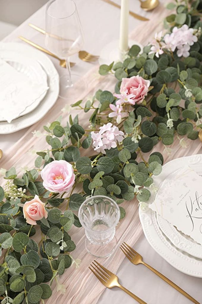 Subtle-greenery-garlands-down-the-center-of-the-table-Easter-table-decor
