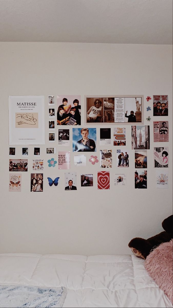 Wall-collage-of-photos-quotes-and-magazine-cutouts
